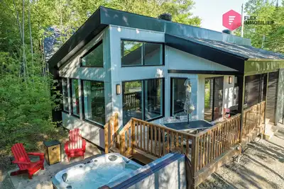 Image de ⭐ Le Coureur des bois de Portneuf 🪓 Spa privé Sauna Piscine Billards Sentiers ⭐