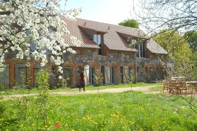 Image de Stylishly furnished fieldstone barn with dining room and terrace by the village pond