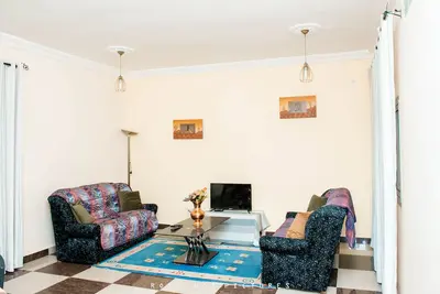 Image de Odza, Appart moderne, 3 chambres, parking privé, véranda
