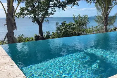 Discount June 14-28, Luxury Waterfront 6br home, infinity pool, boat dock, kayak