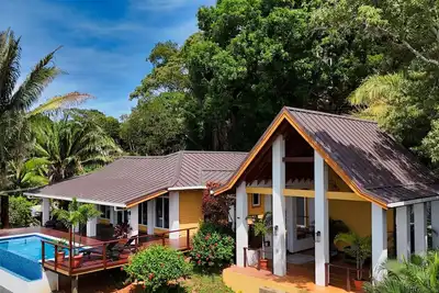 Image de Relax at this hillside retreat that overlooks the lush forest and the Caribbean.