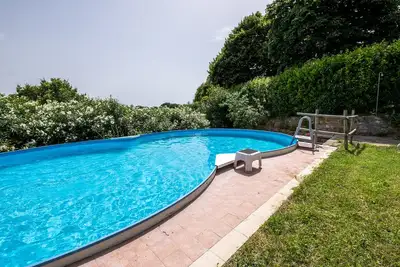 Image de Appartement \"Agriturismo La Pieve - Margherite\" avec piscine partagée, jardin partagé et Wi-Fi.