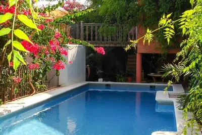 Image de Appartement 'Navila Gastone' avec piscine partagée, Wi-Fi et climatisation.