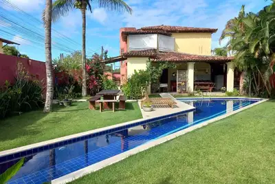 Image de Casa com quatro suítes, piscina e churrasqueira