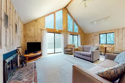 Charming home with fireplace, game room, full kitchen, gas grill, & balcony