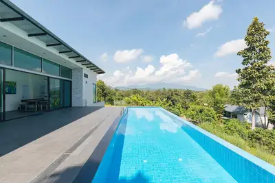 Image de Swimming pool along the terrace, panoramic view surrounded by nature