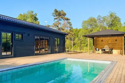 Image de Maison confortable à äspered avec sauna