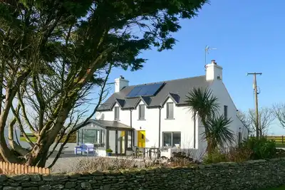 Image de A perfectly reclaimed cottage with uninterrupted views of the Atlantic Ocean. . . .