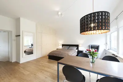 Image de Stylish studio apartment with green views