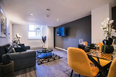 Image de A 1 bedroom apartment with an open plan kitchen, diner, and lounge.