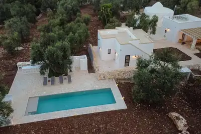 Image de Ancient trullo with swimming pool in Ostuni. Elegant residence among the olive trees.