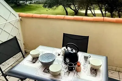 Image de Appartement duplex, 6 personnes, vue mer et golf, accès gratuit parc aquatique