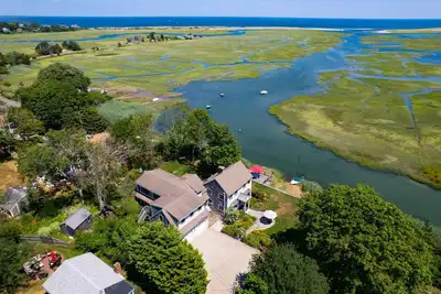 Magnificent views of tidal creek from all rooms. Large home has a dock and plenty of space.