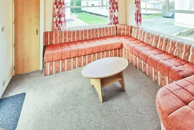 Image de Comfortable caravan with one double and two twin.