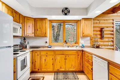 Image de Secluded, dog-friendly home with tree-lined view, firepit, fireplace, & deck