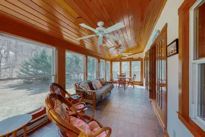 Image de Lakefront home with large yard, firepit, canoe, and fireplace