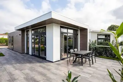 Image de Modern holiday home with a view of a tranquil pond