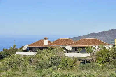 Image de Casa Los Suenos cozy country house with sea and mountain views