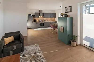 Completed in early 2017, this 80 sqm penthouse apartment in Norddeich's prime location is certainly one of the most beautiful (vacation) apartments on the entire North Sea coast. The apartment has an exceptionally. . .