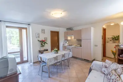 Image de Appartement 'Casa Rita App 4 A' avec terrasse, jardin et Wi-Fi partagés.