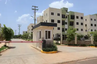 Image de 10 minutes from the beach and the airport, family-sized condo