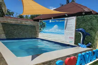 Image de 1 min walk to beach Vacation House with pool
