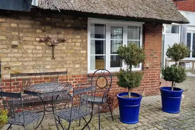 Welcome to this unique historic thatched-roof cottage in the village center v
