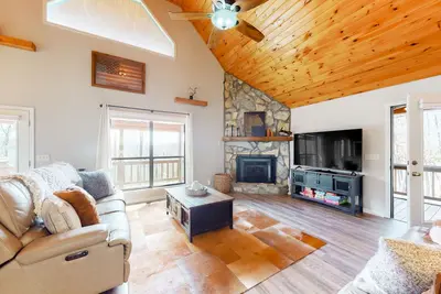 Image de Scenic country retreat with firepit, covered deck, grill, & fireplace