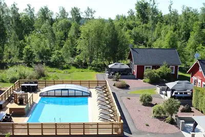 Image de Luxurious cottage with lake view, Boat and heated swimming pool outside the door