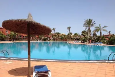 Appartement dans un beau complexe avec palmiers et grandes piscines