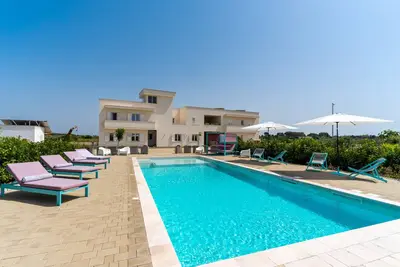 Image de Appartement de vacances 'Le Scuderie 11' avec piscine partagée, jardin partagé et Wi-Fi