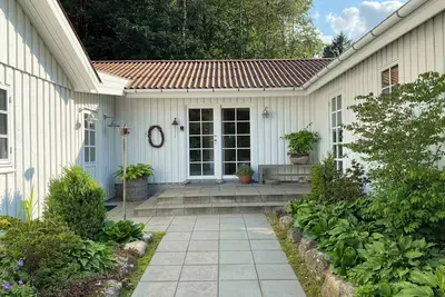 Image de Idyllically situated wooden house by the forest