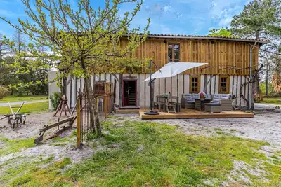 Image de Maison La Grange avec piscine partagée et climatisation à Trensacq