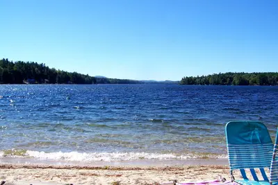 Image de Great East Lake cottage across camp road to a large sandy shared beach. View2NH!