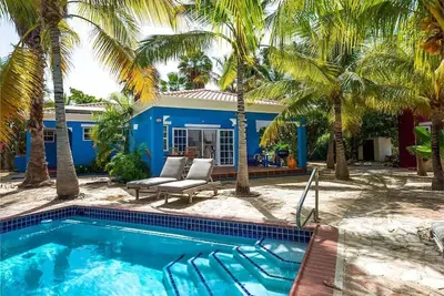 Well furnished, 1 story open floor plan villa with veranda and adjacent to pool.