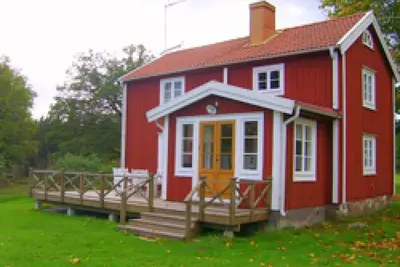 Image de Typical red and white holiday home in the forests of Småland not far from the lake with boat, internet and sauna by the lake