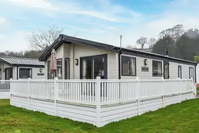 Image de A spacious and stylish detached lodge is set within a well-regared holiday park.