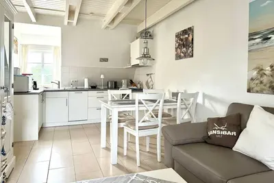 Image de Friesenglück - 3-room vacation apartment for up to 4 people with sunbathing area.