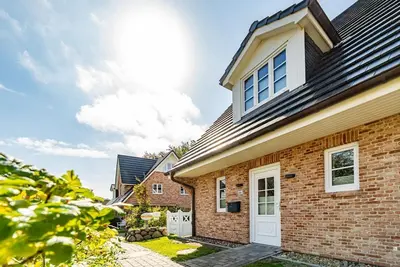 Image de Sylt Oase - semi-detached vacation home for max. 6 persons with sauna, garden and