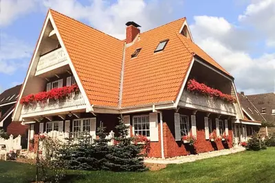 Image de Apartment with a view of the dyke for up to 4 people. -Turquoise