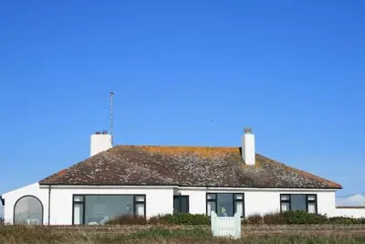 Image de 1930's bungalow nr Rhosneigr, opposite beach, large garden and amazing views.