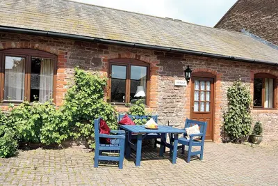 Image de This converted cottage offers wheelchair access, 2 en-suite bedrooms and an acre of grounds.