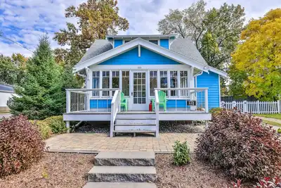 Charming lakefront home with shared dock, porch, & sunroom - walk downtown