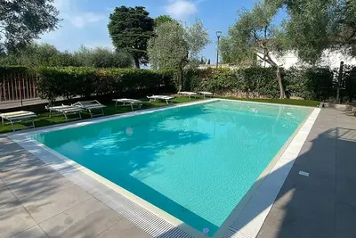 Image de Apartment Farfalla with air conditioning, pool 10 x 5 and parking, 250 meters from the lake