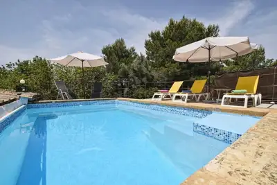 Image de Maison de vacances 'Montserrat' avec vue sur la montagne, piscine privée et Wi-Fi