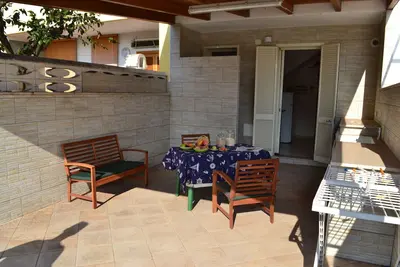 Image de Maison de deux étages à San Foca avec espaces extérieurs et climatisation