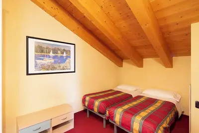 Image de Appartement 'Chalet Li Palù Trilocale 4' avec vue sur les montagnes, balcon et Wi-Fi