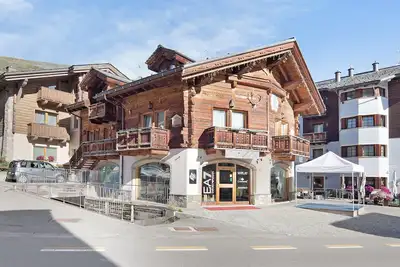 Image de Appartement 'Chalet Picchio Quadrilocale' avec vue sur les montagnes, balcon et Wi-Fi