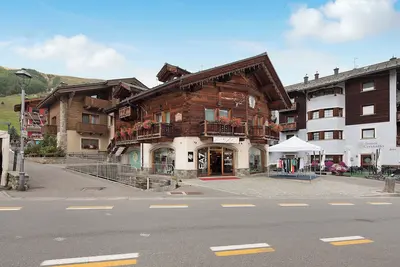 Image de Appartement 'Chalet Picchio Trilocale' avec vue sur les montagnes, balcon et Wi-Fi