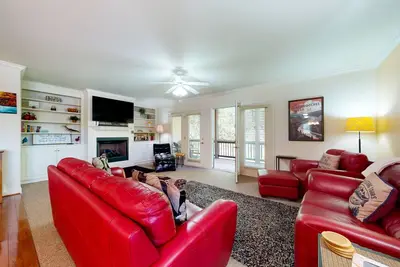 Inviting riverfront condo with fireplace, balcony, central Ac, & W/D